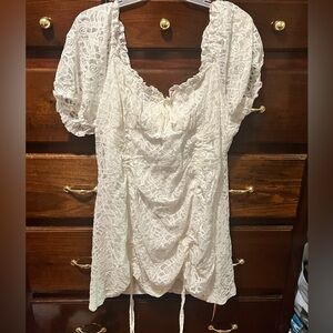 Beautiful white lace dress with draw string sides.
